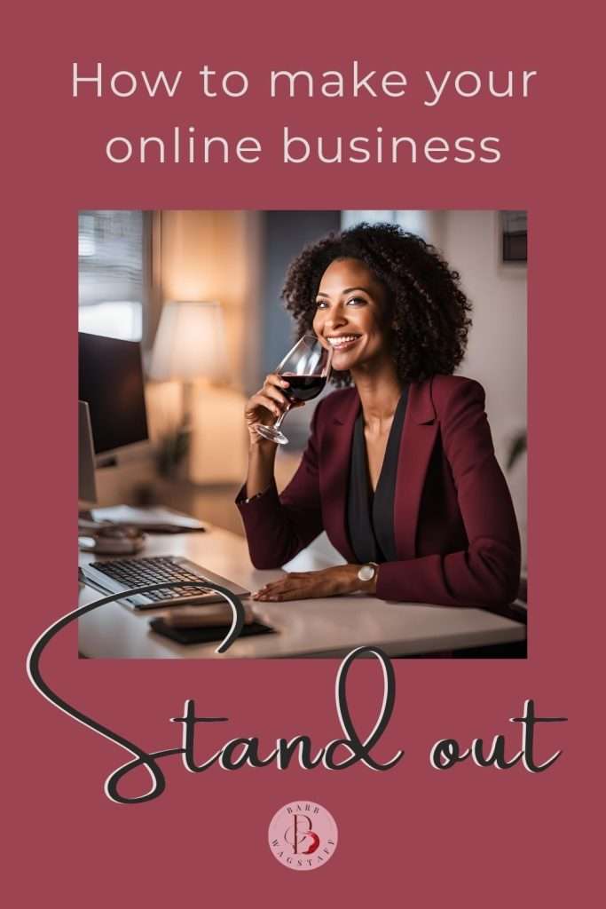 how to make your online business stand out written above a woman holding a wine glass, looking happily at her computer screen.