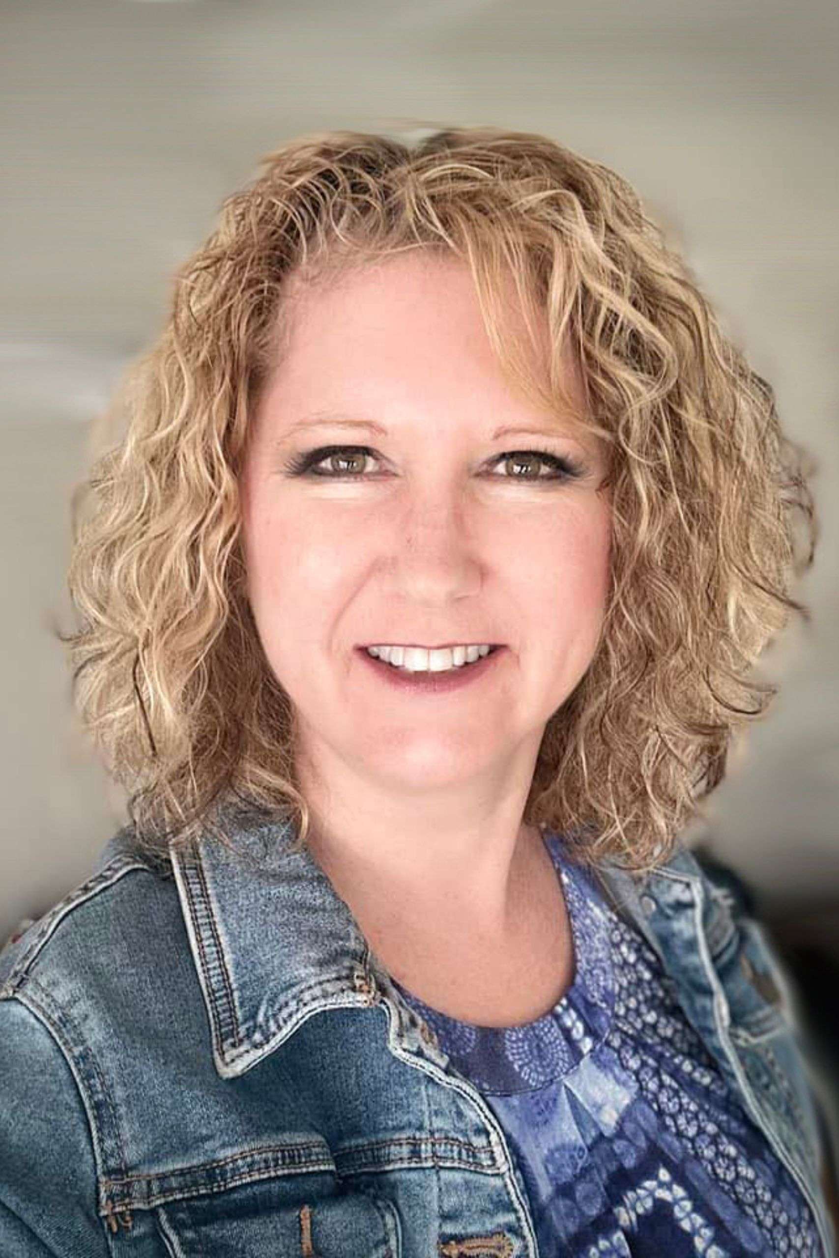 Barb Wagstaff wearing jean jacket and blue top